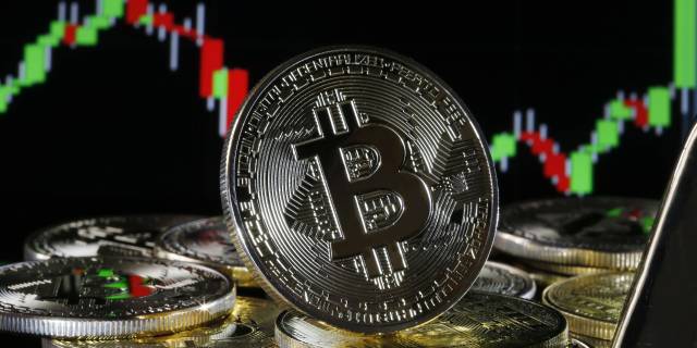 Bitcoin surpasses $50,000 for first time as major companies jump into crypto